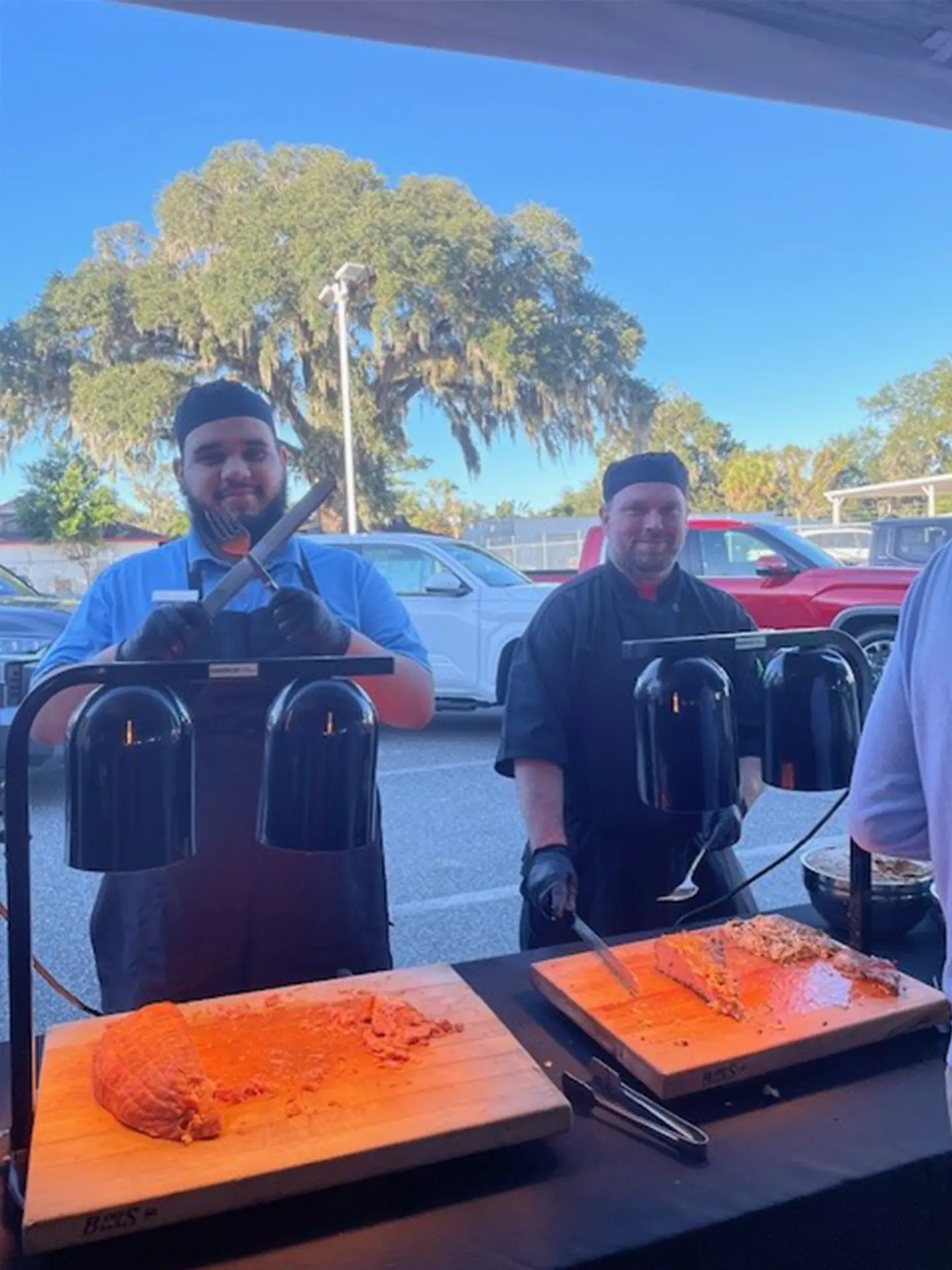 Carving station at DeLuca Toyota mixer by Catering Ocala